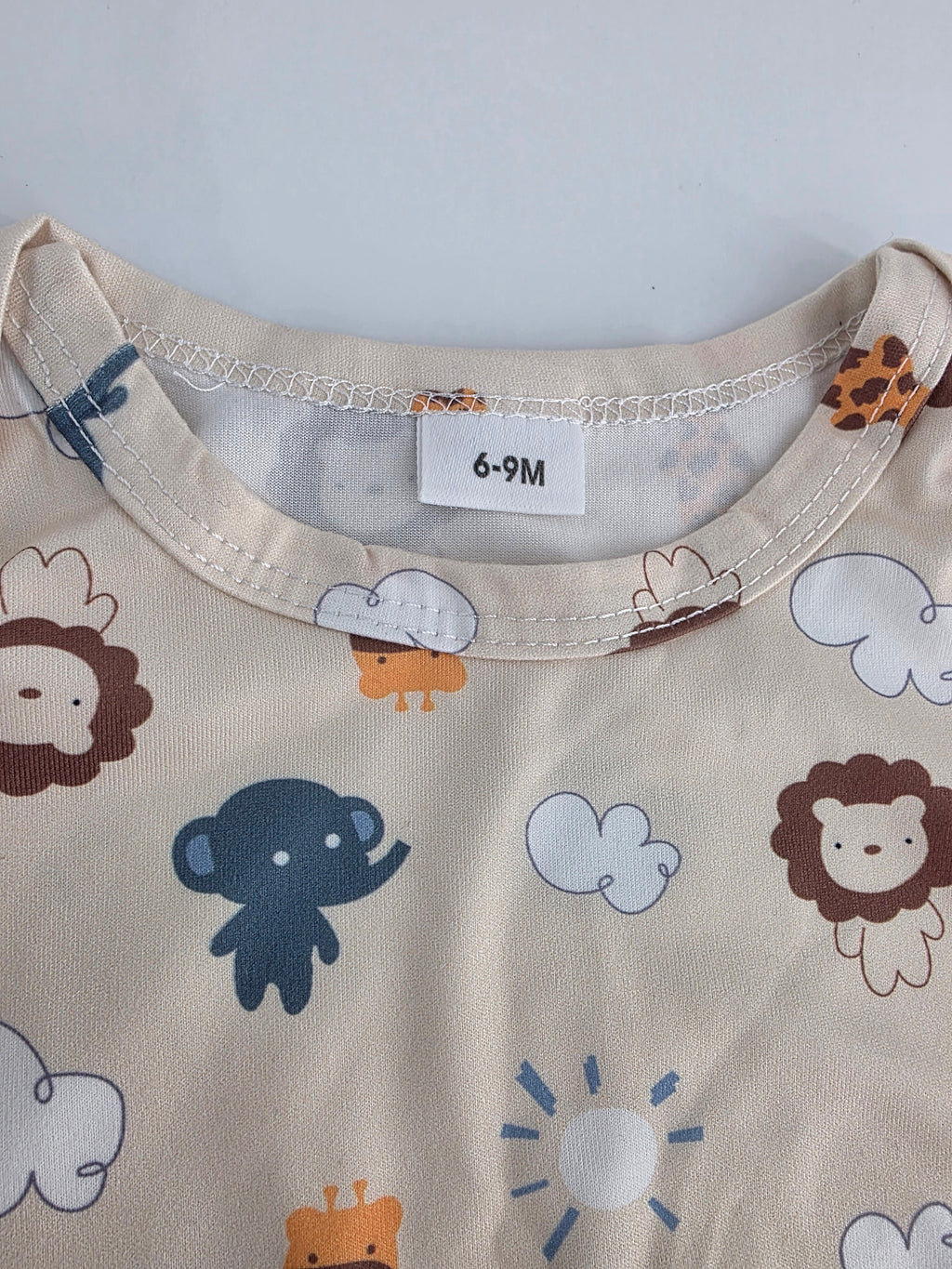 Safari Animal Footed Romper – 6–9M
